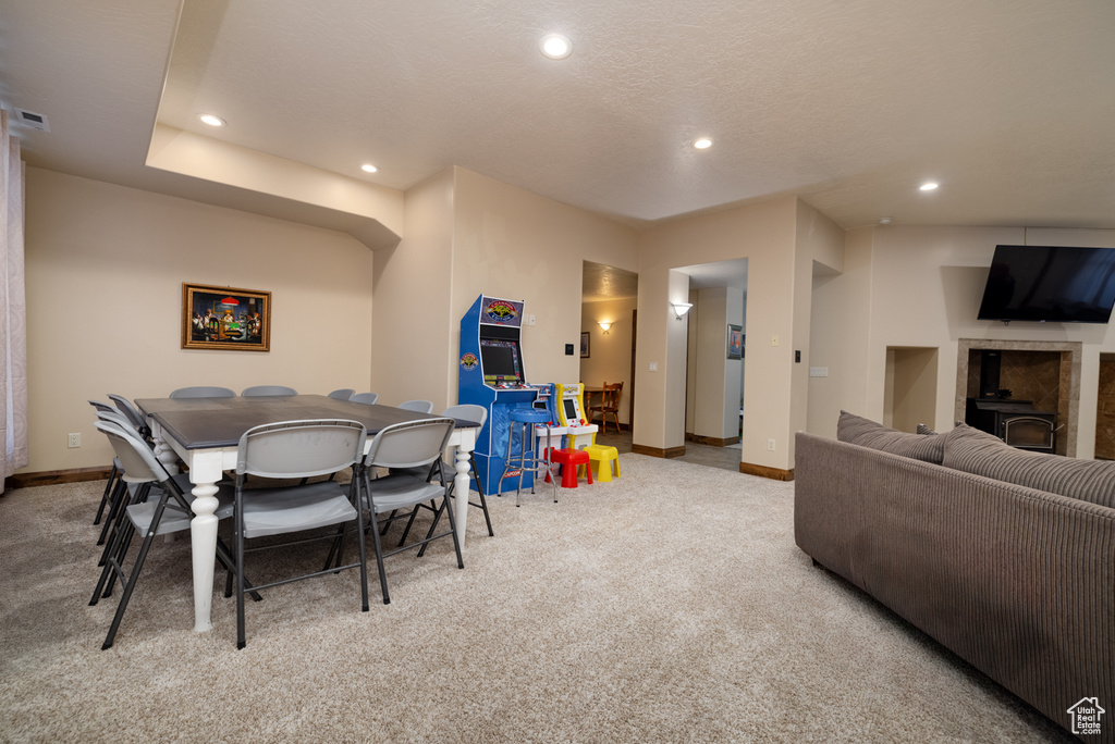 Dining area with carpet flooring and recessed lighting