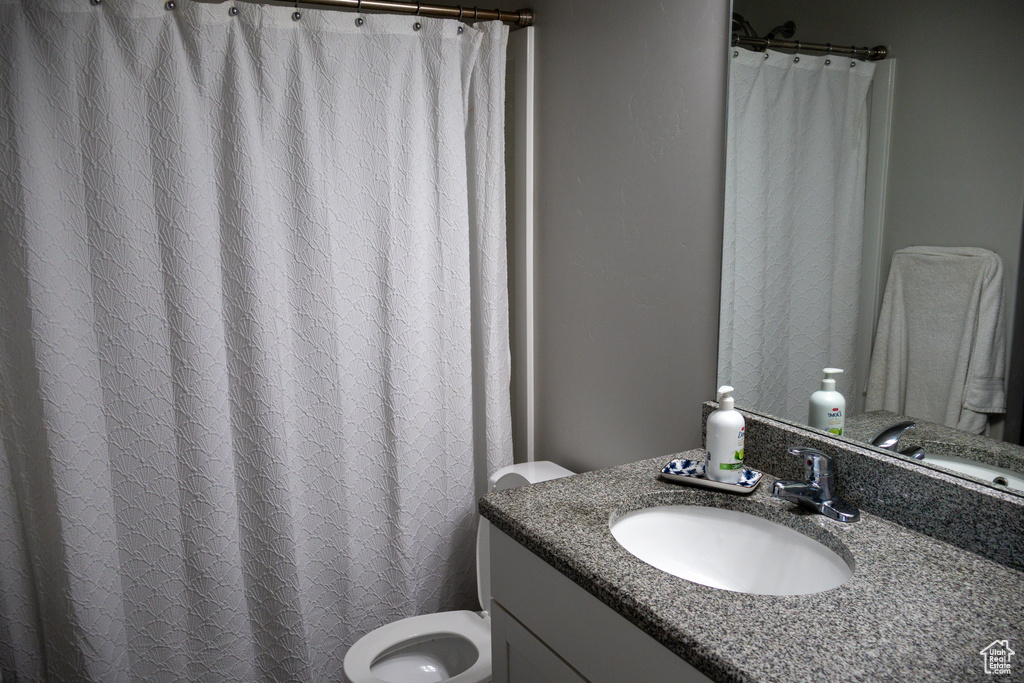Full bath featuring vanity and a shower with shower curtain