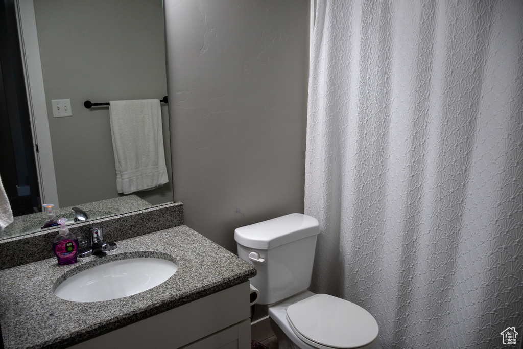 Bathroom featuring vanity and a shower with shower curtain