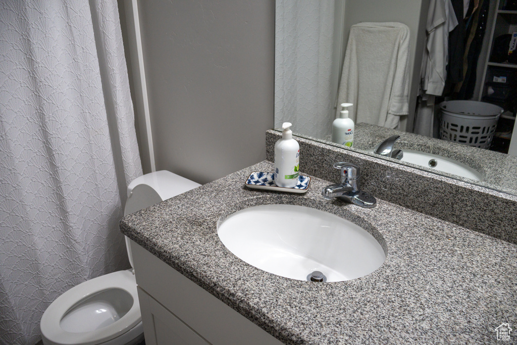 Bathroom with vanity and curtained shower