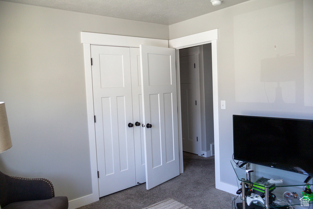 Bedroom with carpet floors and a closet