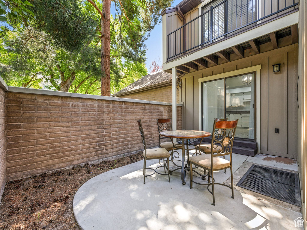 Patio / terrace featuring a fenced backyard, a patio, and outdoor dining space