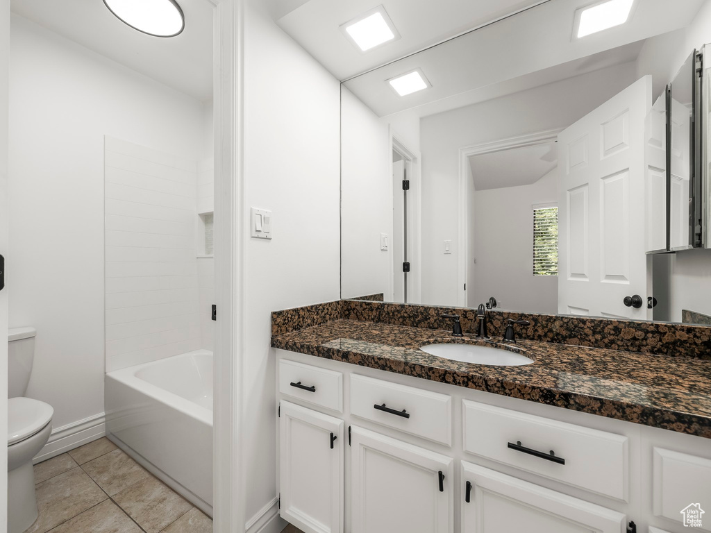 Full bathroom featuring vanity, tile patterned floors, and bathtub / shower combination