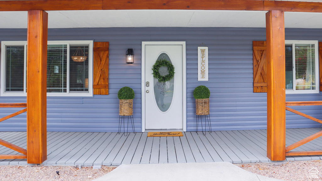 Property entrance with covered porch