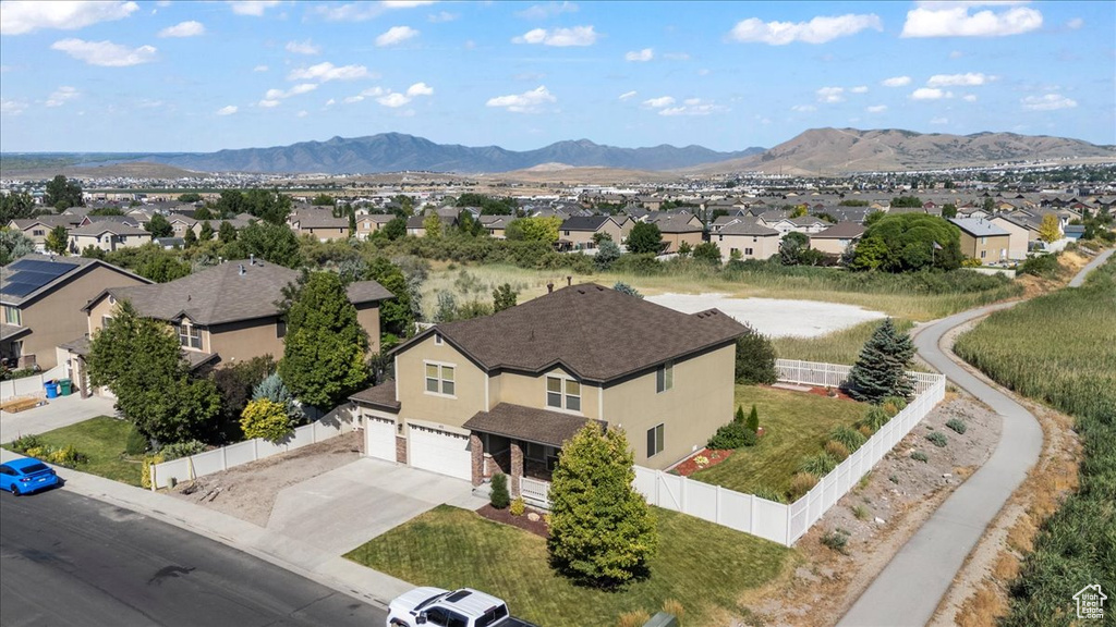 Aerial perspective of suburban area featuring a mountain backdrop