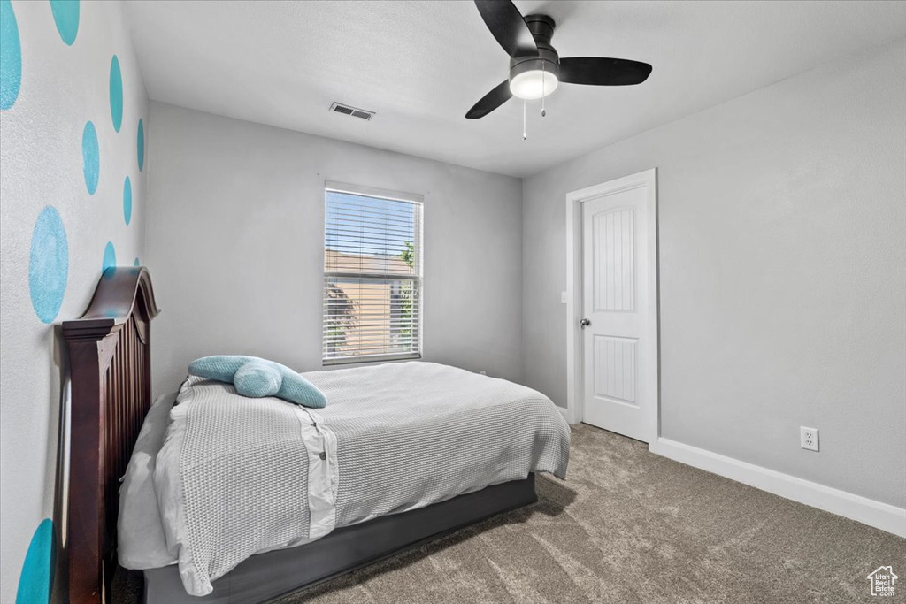 Bedroom with carpet and ceiling fan