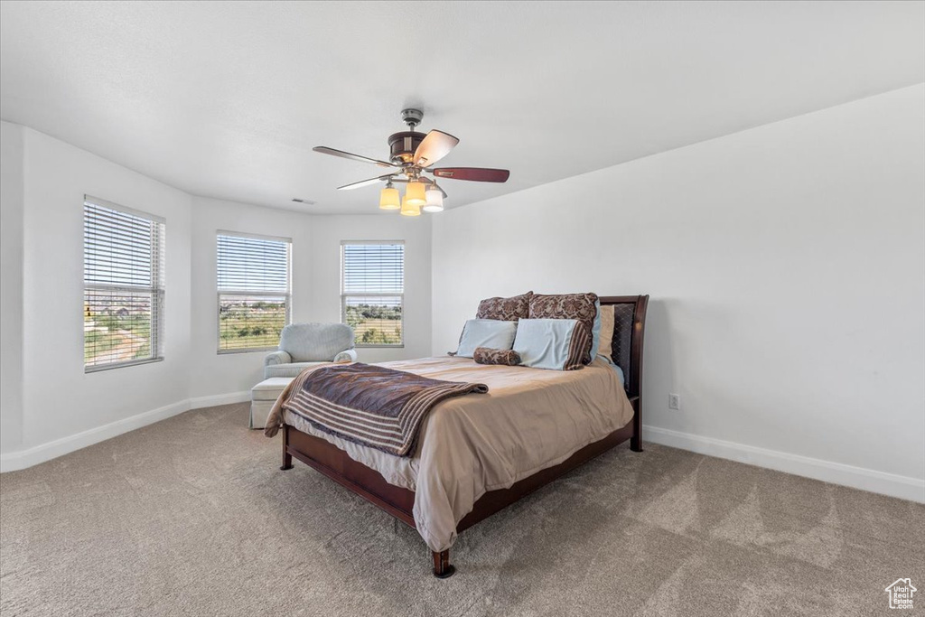 Bedroom featuring carpet floors and ceiling fan