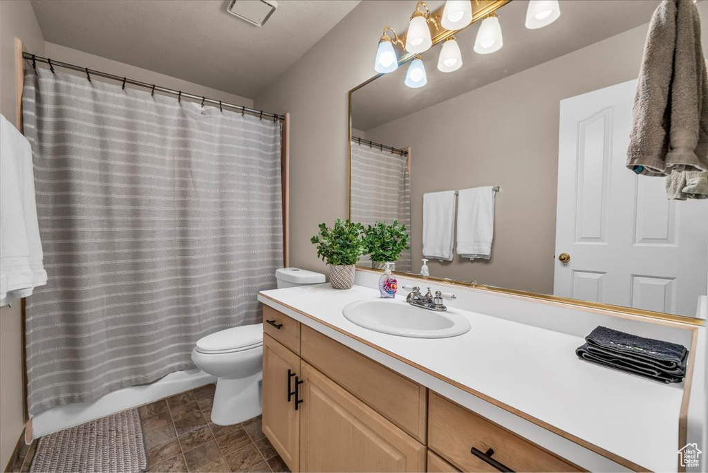 Full bath featuring vanity and a shower with curtain