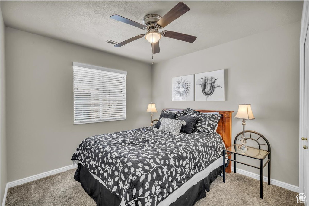 Bedroom featuring carpet flooring and a ceiling fan
