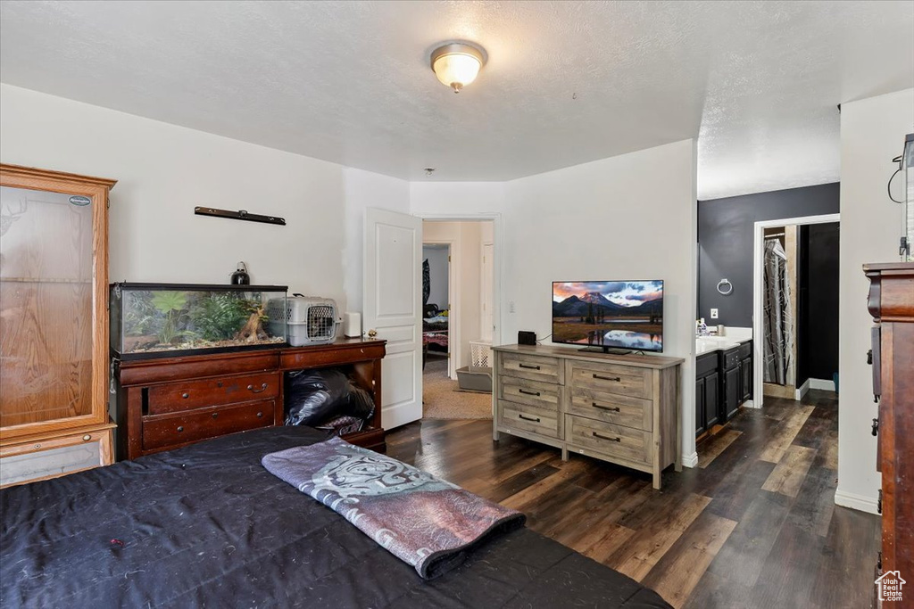 Bedroom featuring dark wood finished floors