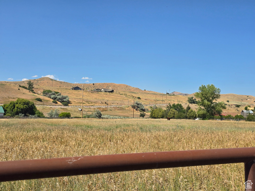 View of mountain backdrop with rural landscape