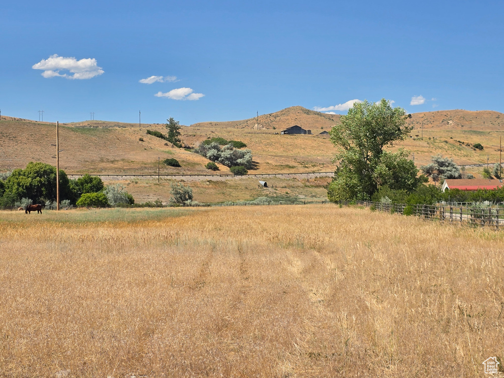 View of mountain backdrop featuring rural landscape