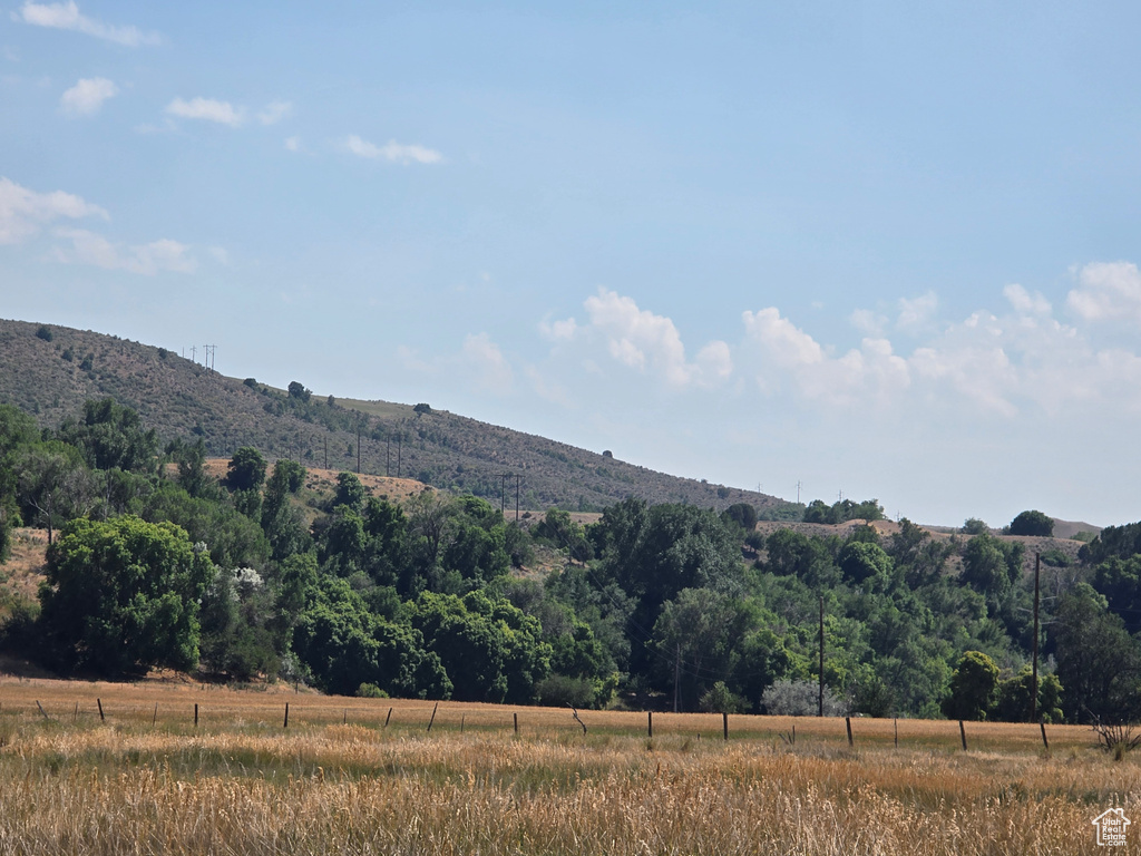 View of mountain backdrop with rural landscape