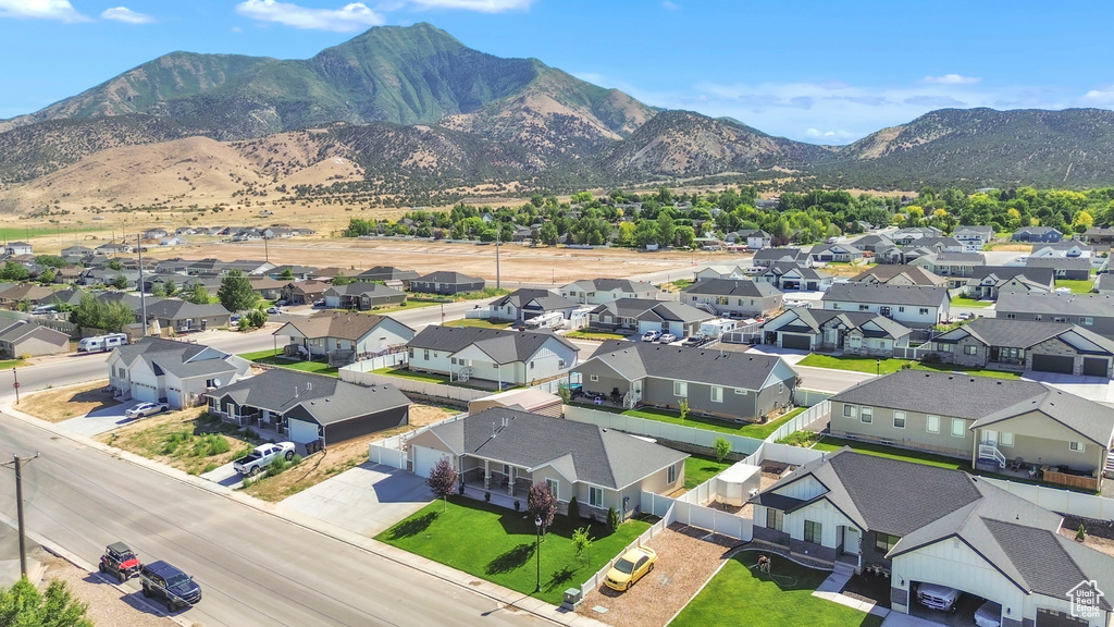 Aerial perspective of suburban area featuring a mountain backdrop