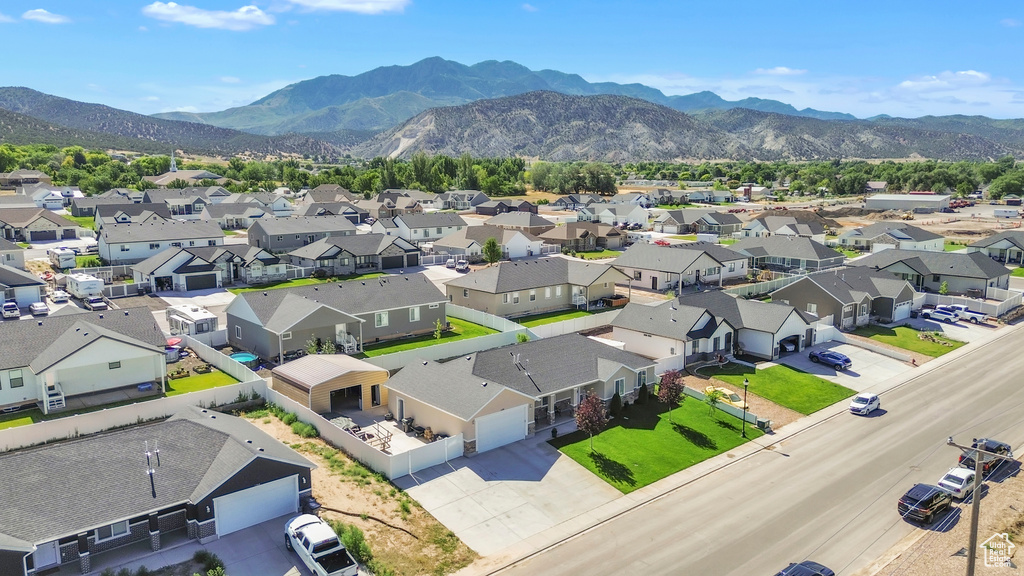 Aerial view of residential area featuring a mountain backdrop