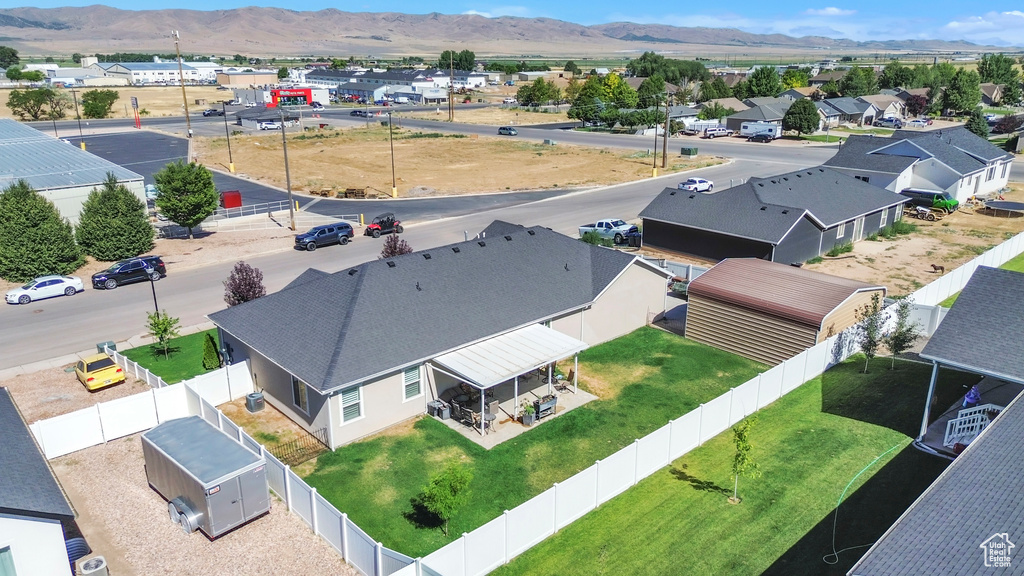 Aerial view of residential area featuring a mountain backdrop