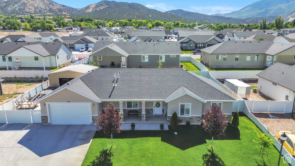 Aerial perspective of suburban area featuring a mountain backdrop