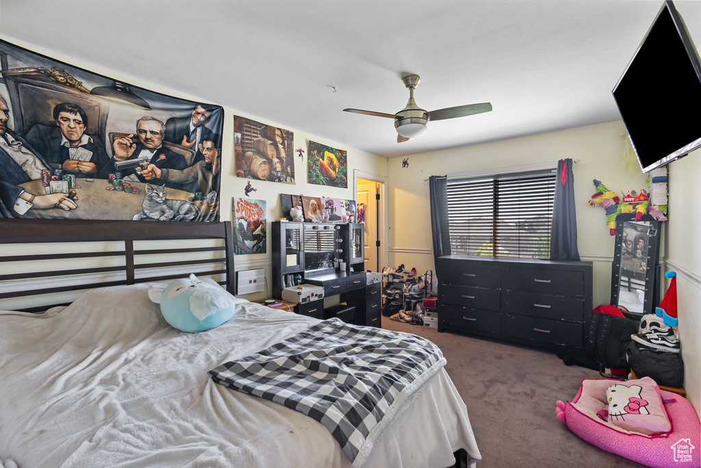 Carpeted bedroom with ceiling fan