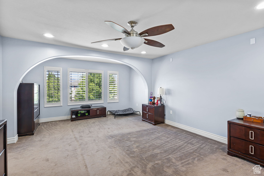 Carpeted bedroom featuring recessed lighting and a ceiling fan