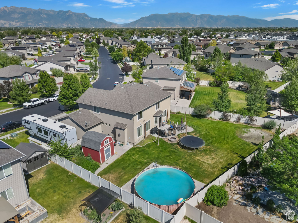 Aerial view of residential area with a mountainous background