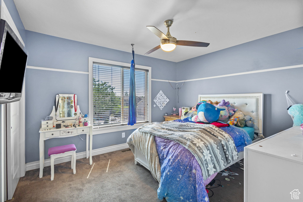 Bedroom with carpet floors and ceiling fan