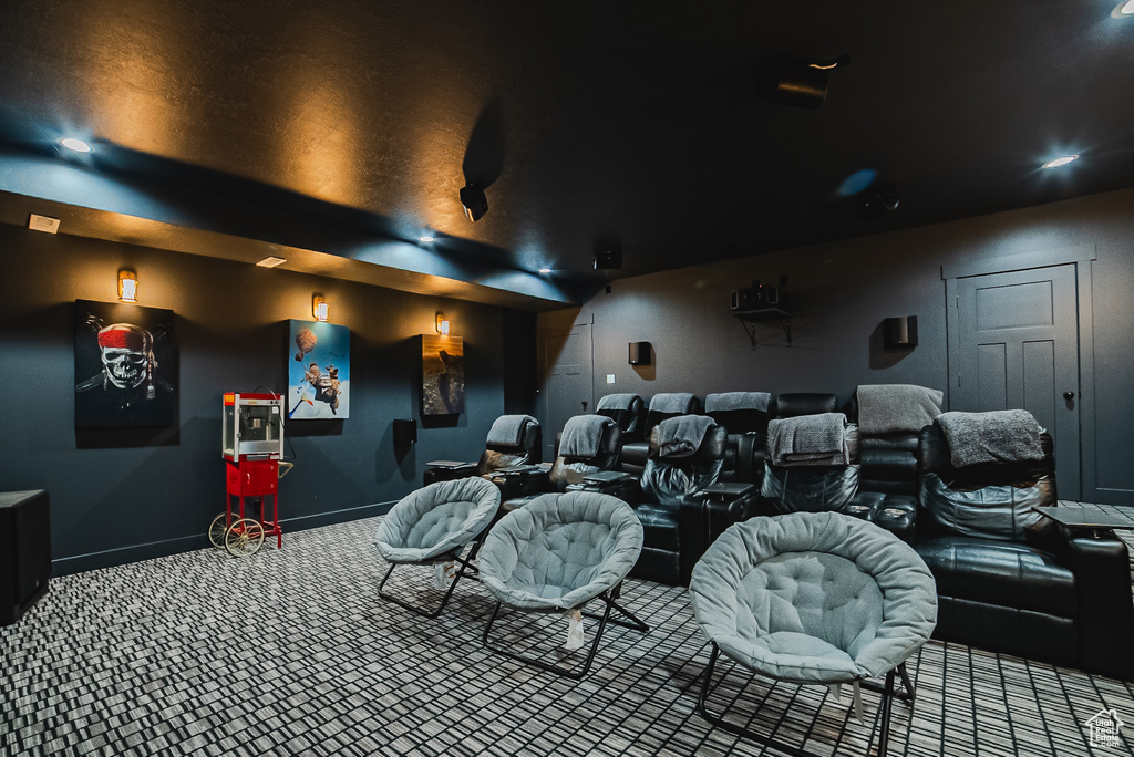 Home theater room featuring carpet floors and baseboards