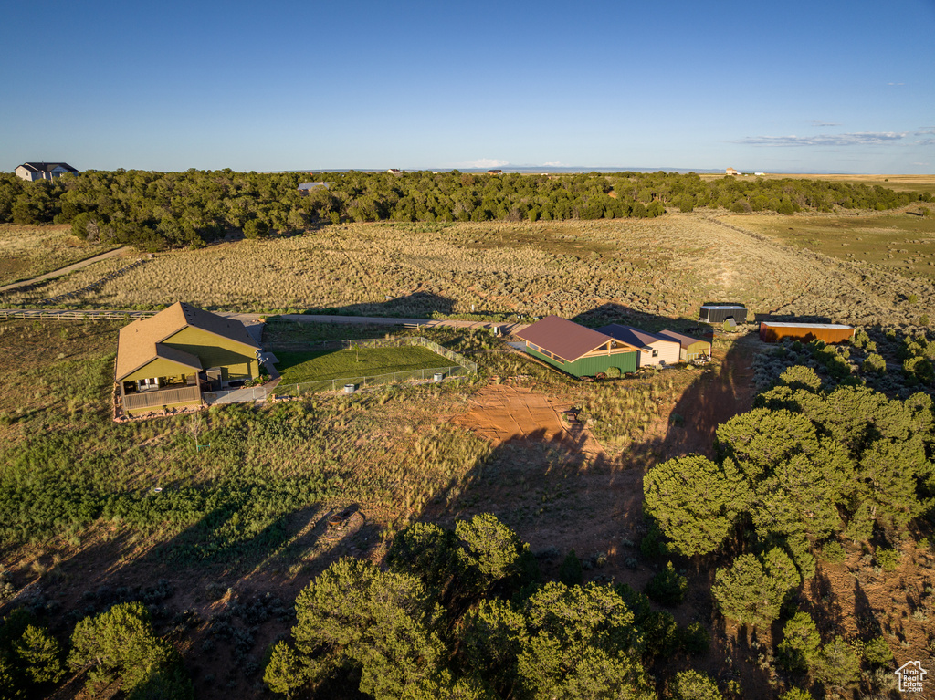 Aerial view of property and surrounding area featuring rural landscape