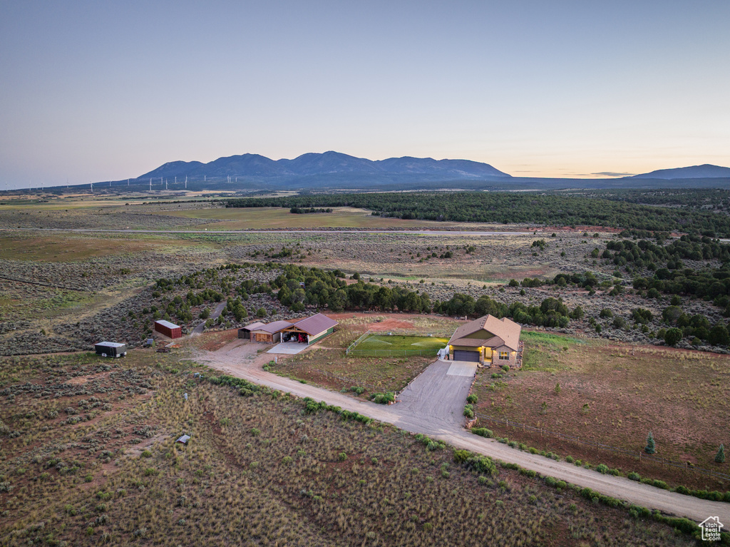 Aerial view at dusk of a mountain view and a rural view