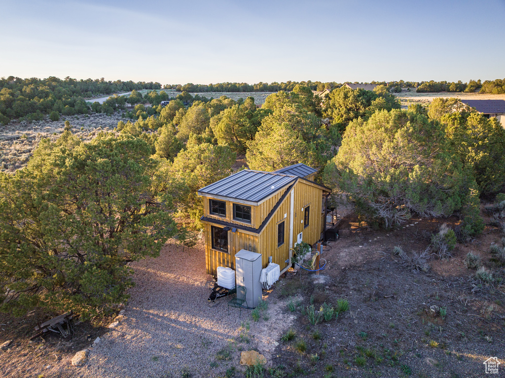 View from above of property with a forest