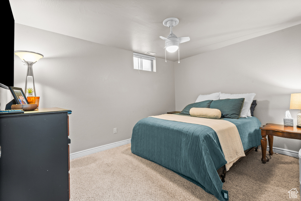 Bedroom with carpet flooring and ceiling fan