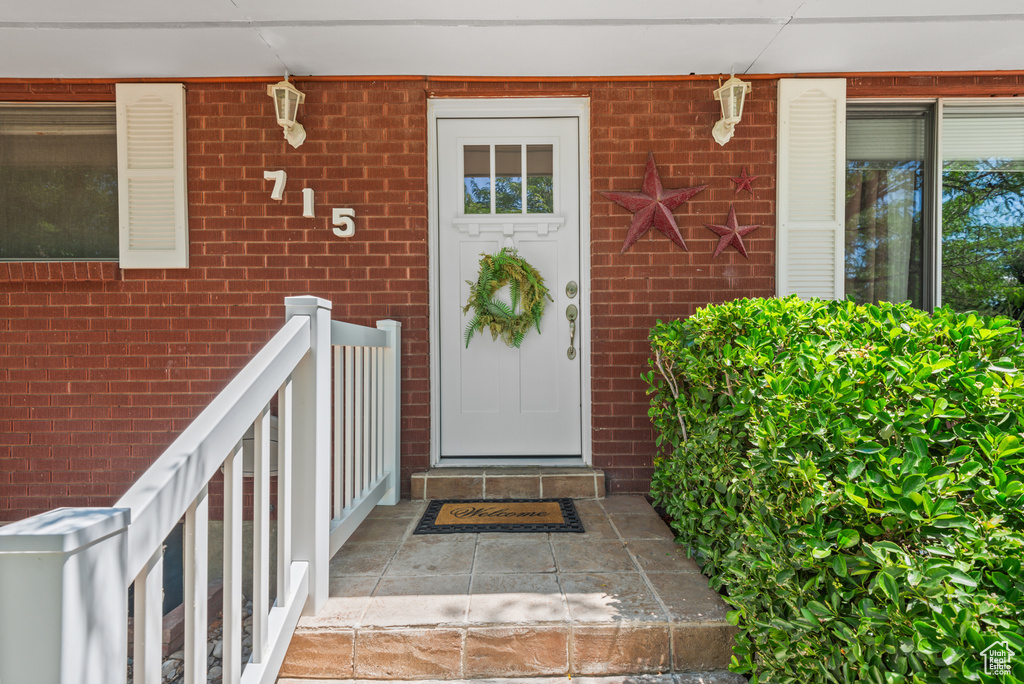 Entrance to property with brick siding