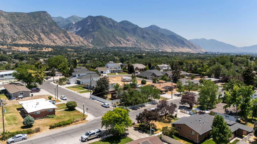 Aerial view of residential area featuring a mountain backdrop