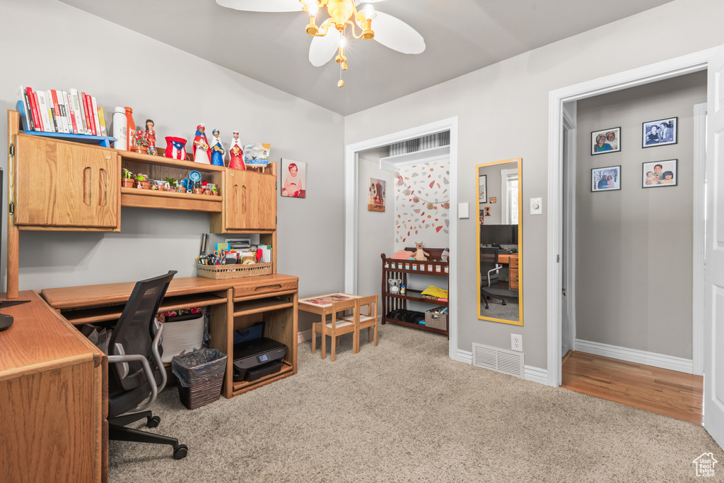 Office area featuring carpet flooring and a ceiling fan