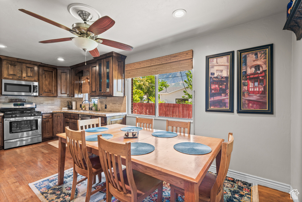 Dining area featuring recessed lighting, a ceiling fan, and light wood-style floors