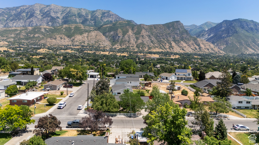 View of mountain backdrop featuring nearby suburban area