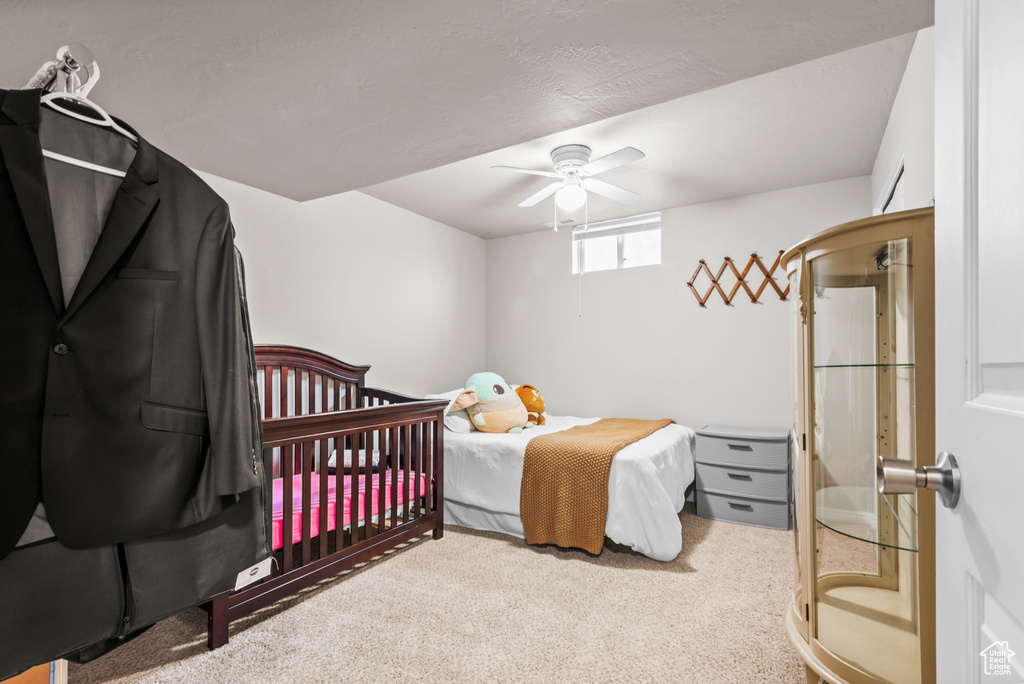 Bedroom featuring carpet floors and ceiling fan