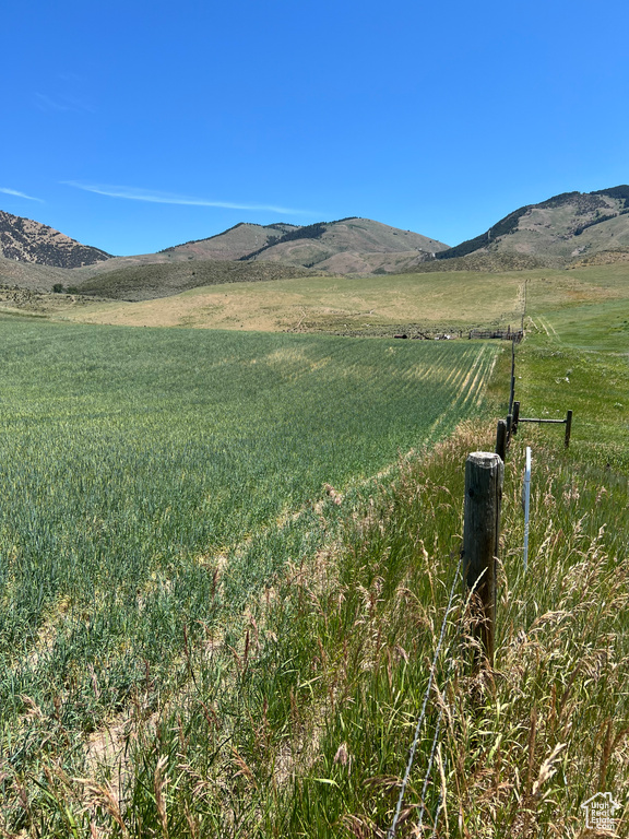 View of mountain backdrop featuring rural landscape