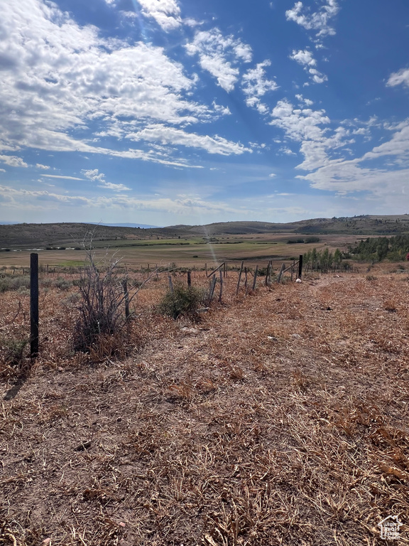 View of yard with a rural view