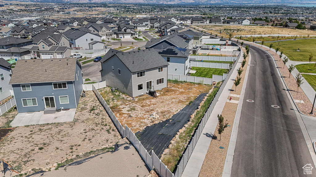 Aerial perspective of suburban area with a mountainous background