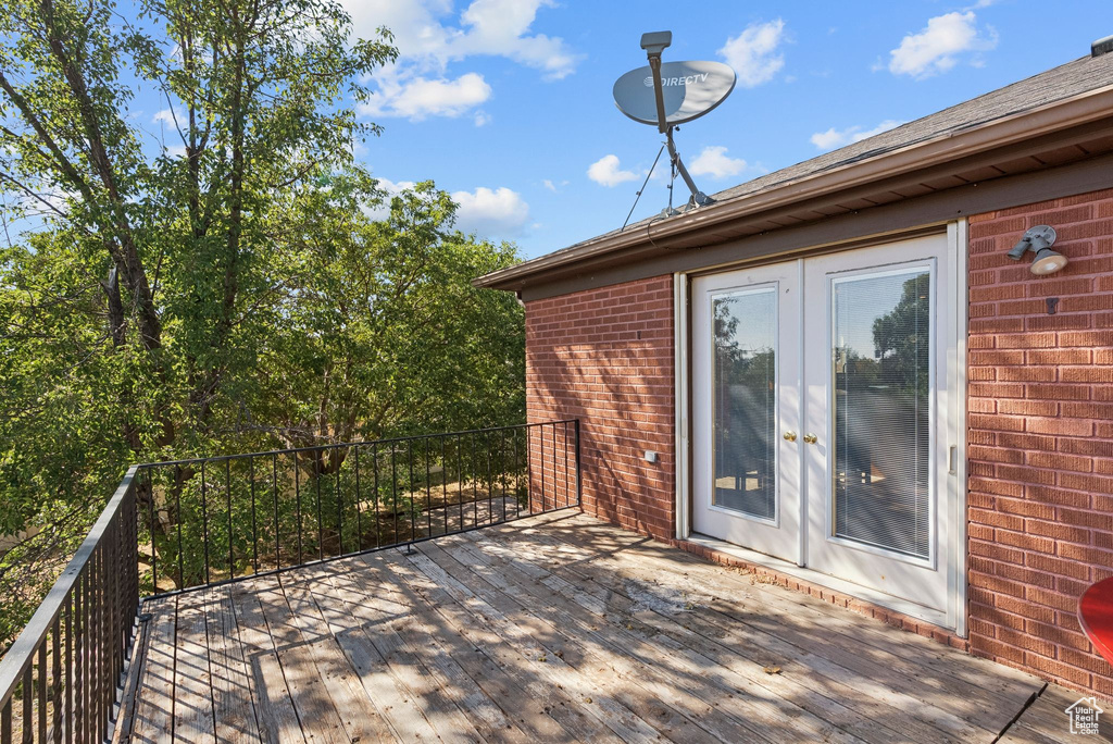 Wooden terrace featuring french doors
