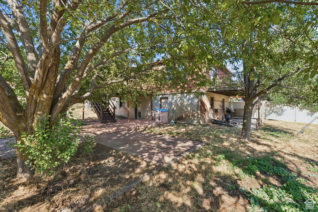 View of yard featuring stairs