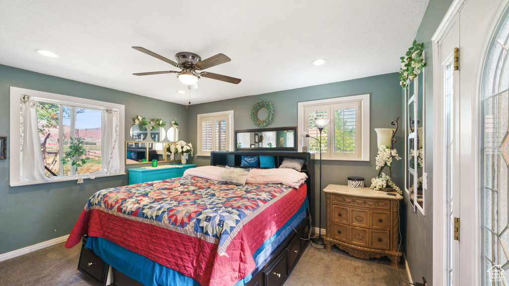 Carpeted bedroom featuring recessed lighting and ceiling fan