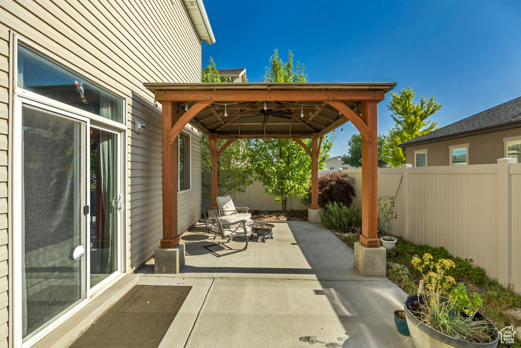 Fenced backyard with a gazebo and a patio
