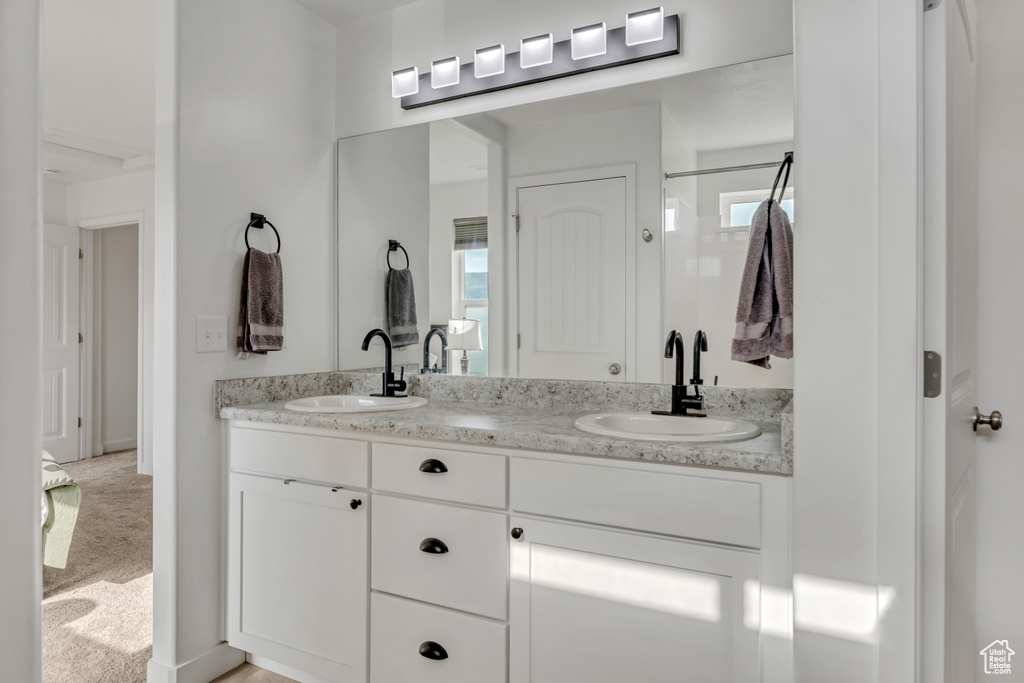 Bathroom featuring double vanity