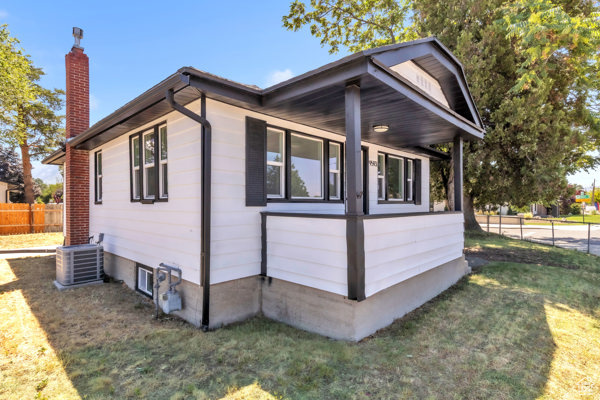 View of home\'s exterior with a central air condition unit and a chimney