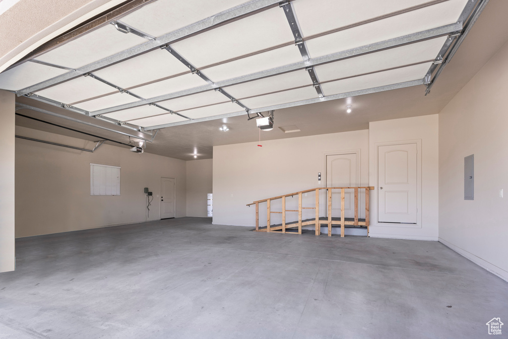 Garage with a garage door opener and electric panel