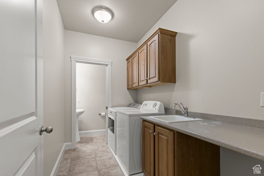 Washroom with independent washer and dryer and cabinet space
