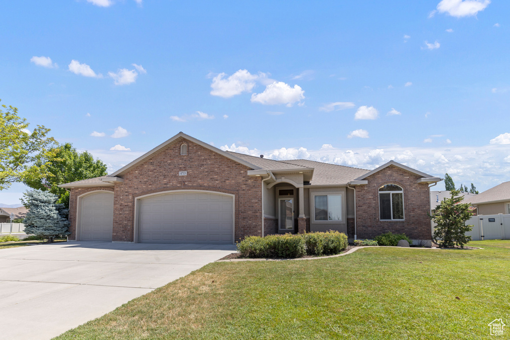Ranch-style house with an attached garage, brick siding, concrete driveway, and roof with shingles