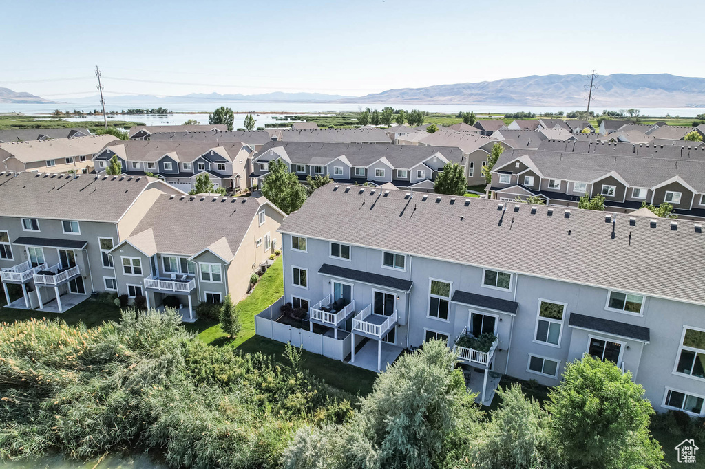 Aerial view of residential area featuring a mountainous background