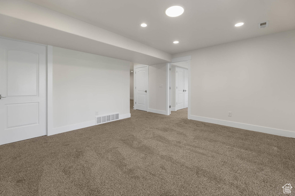 Below grade area with carpet and recessed lighting